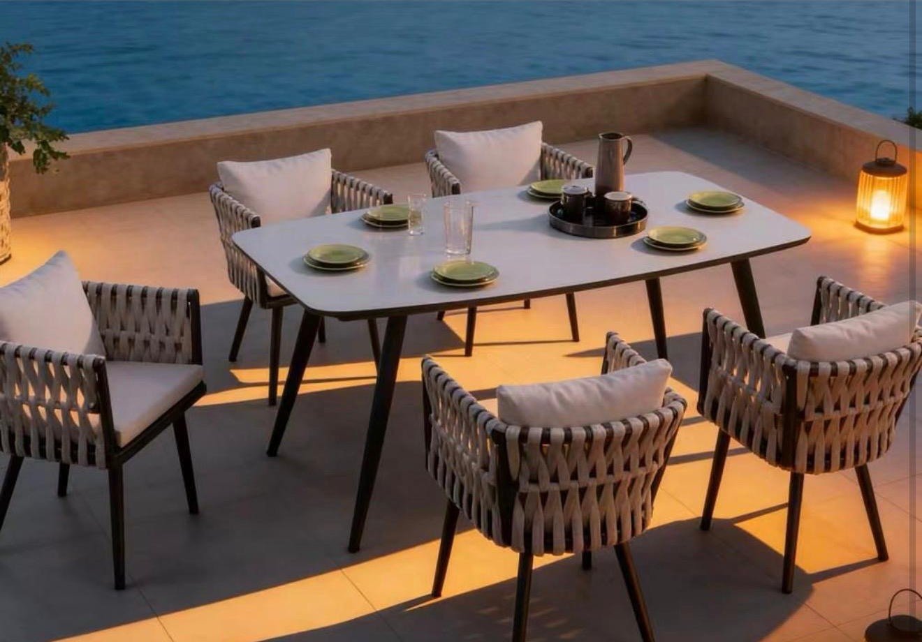 Elysian Dining Elysian Dining – outdoor dining setting with light-top table and woven-back armchairs