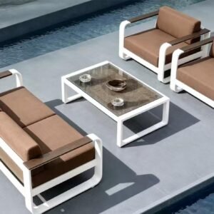 The Monaco Grand Lounge Set – white-frame outdoor lounge set with tan cushions and glass-top table