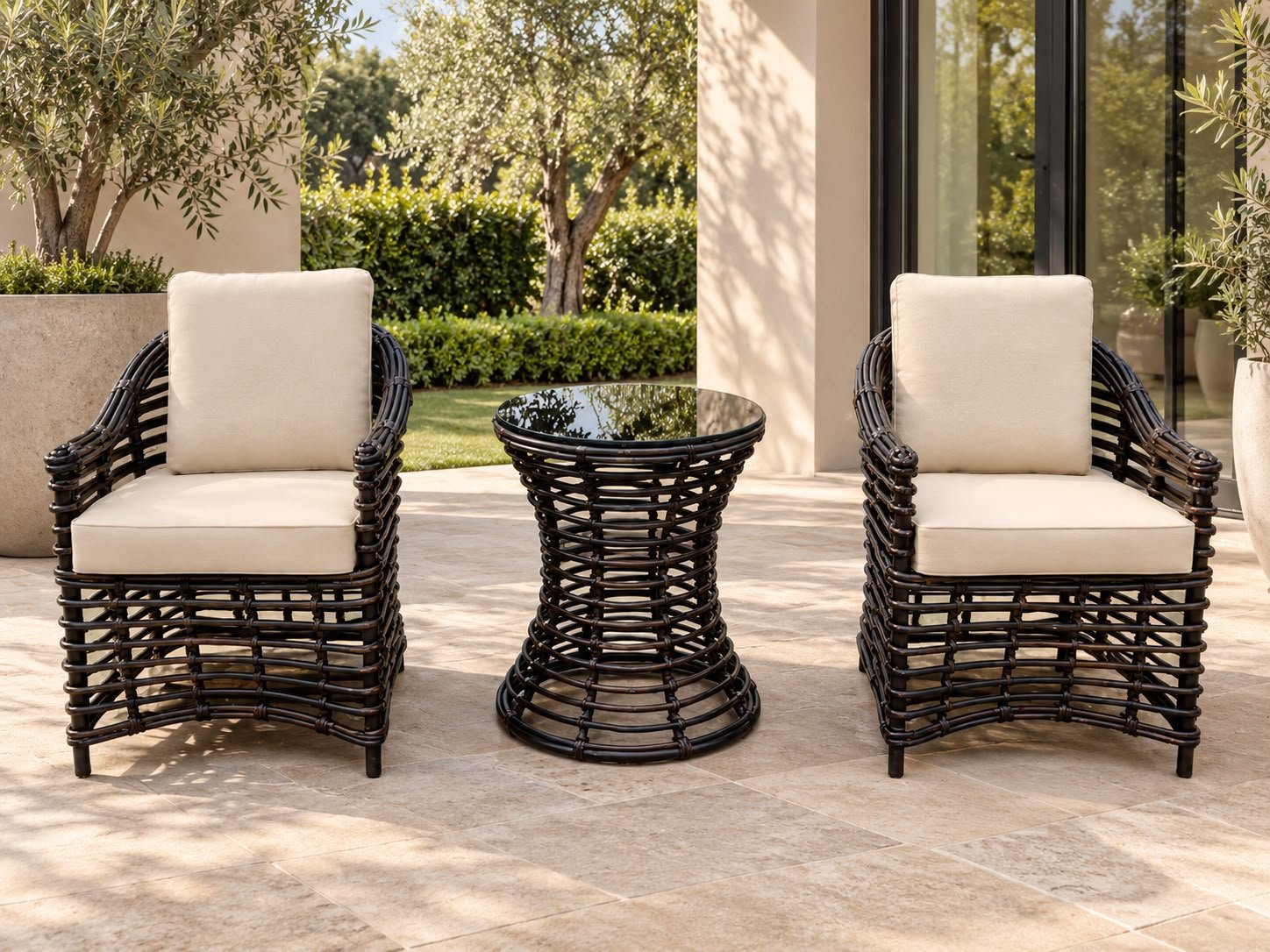The Patio Set The Patio Set – two dark rattan-look outdoor armchairs with hourglass glass-top side table